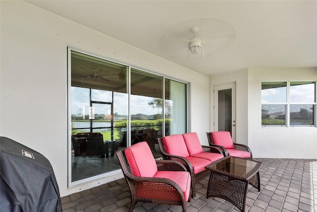 view of patio featuring ceiling fan