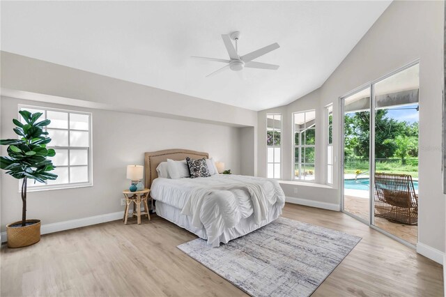 bedroom featuring access to exterior, vaulted ceiling, light hardwood / wood-style flooring, and ceiling fan