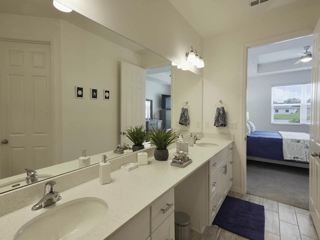 bathroom with vanity, ceiling fan, and tile patterned floors