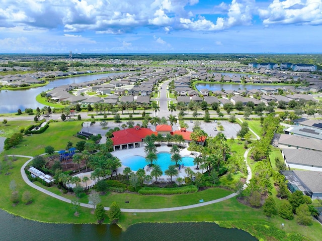 birds eye view of property with a water view