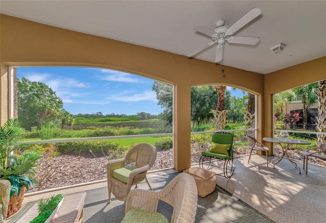 exterior space featuring ceiling fan