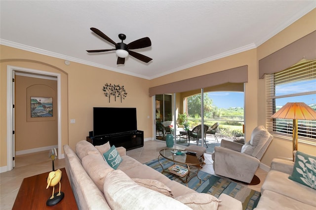 tiled living room with ornamental molding, plenty of natural light, and ceiling fan