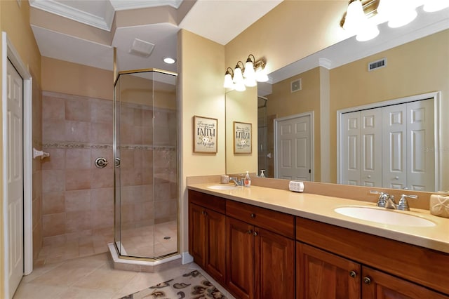 bathroom featuring ornamental molding, vanity, an enclosed shower, and tile patterned flooring