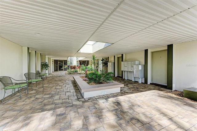 view of patio / terrace featuring a mail area