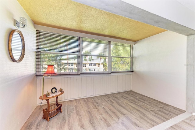 unfurnished room featuring light hardwood / wood-style floors