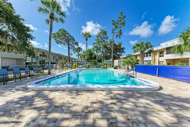 view of swimming pool featuring a patio area