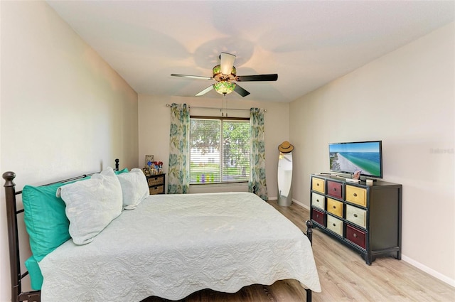 bedroom featuring ceiling fan and light hardwood / wood-style flooring