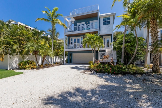 view of front of property with a balcony and a garage