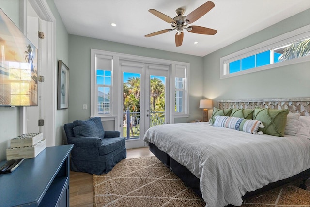 bedroom with french doors, ceiling fan, hardwood / wood-style flooring, and access to outside