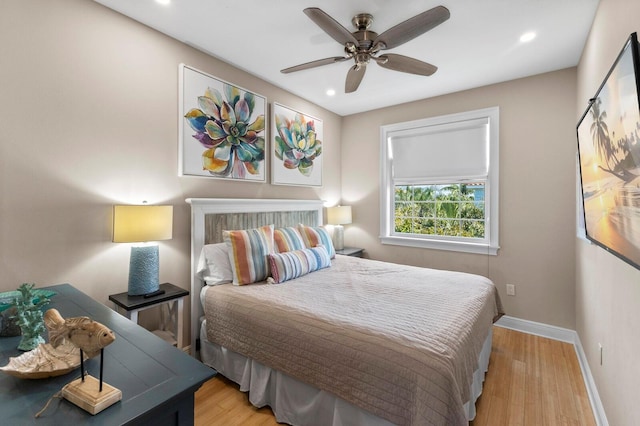 bedroom featuring light hardwood / wood-style flooring and ceiling fan