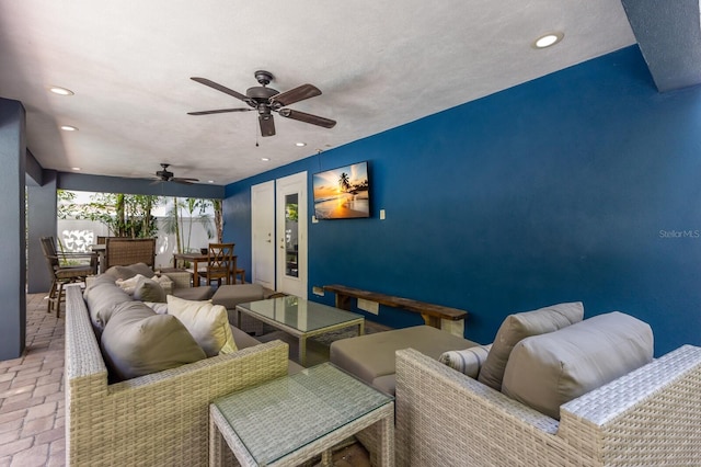 living room featuring ceiling fan