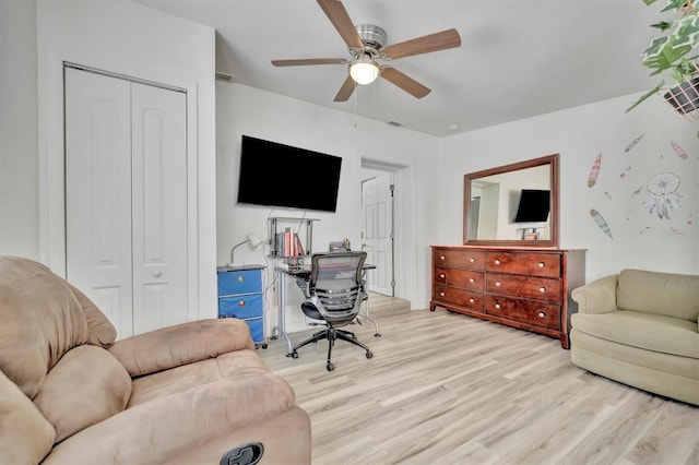 office space featuring ceiling fan and light hardwood / wood-style flooring