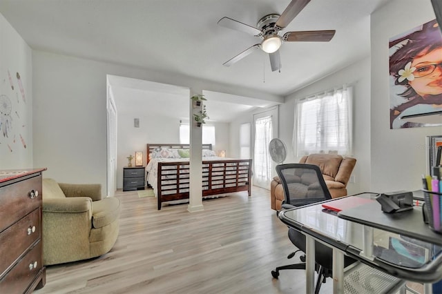 office area with light wood-type flooring and ceiling fan