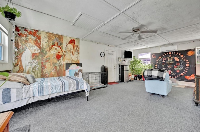 bedroom featuring stainless steel fridge, a wall unit AC, ceiling fan, and carpet floors