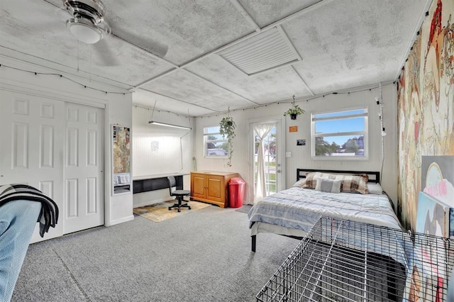 bedroom featuring carpet, ceiling fan, and a closet