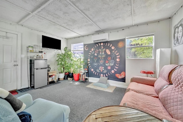 living room featuring a wealth of natural light, carpet flooring, and a wall mounted air conditioner