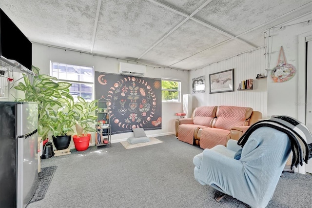 carpeted living area featuring baseboards, a healthy amount of sunlight, and a wall unit AC