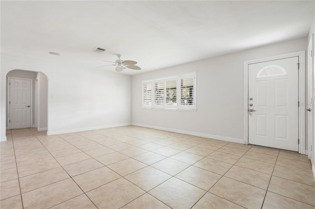 tiled foyer entrance with ceiling fan