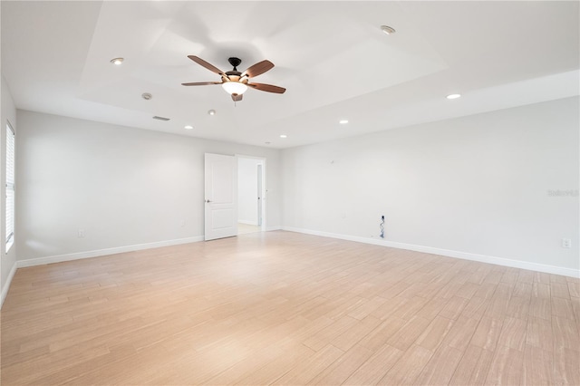 spare room with ceiling fan and light hardwood / wood-style floors