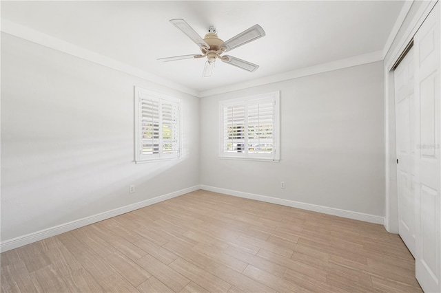 unfurnished bedroom featuring light wood-type flooring, a closet, ceiling fan, and ornamental molding