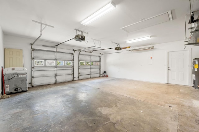 garage with a garage door opener and electric water heater