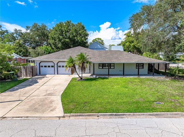 ranch-style home with a front lawn, a garage, and a porch