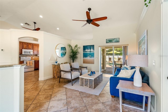 living room with ceiling fan, light tile patterned floors, crown molding, and vaulted ceiling