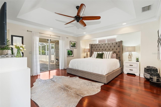 bedroom with visible vents, crown molding, wood-type flooring, and access to outside