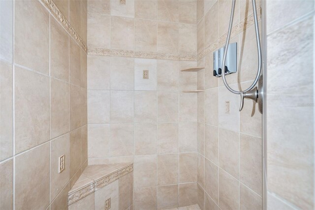 bathroom with a tile shower