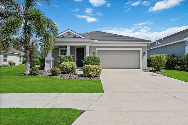 ranch-style home with stucco siding, an attached garage, concrete driveway, and a front yard