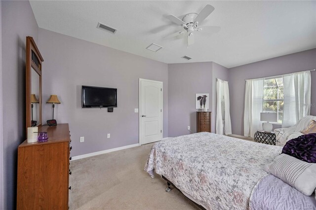 bedroom with ceiling fan and carpet floors