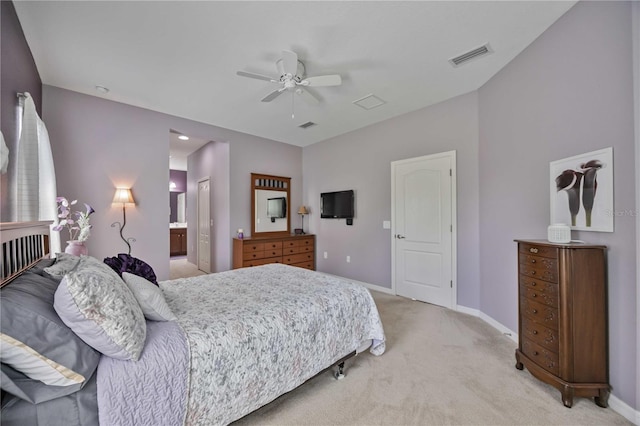 carpeted bedroom with connected bathroom and ceiling fan