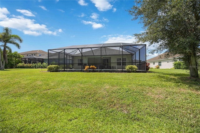 view of yard with glass enclosure