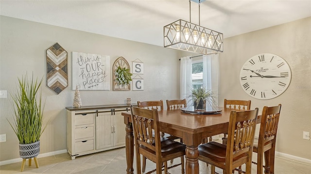 dining area featuring light tile patterned flooring