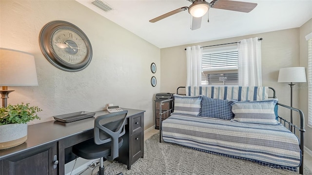 carpeted bedroom with ceiling fan