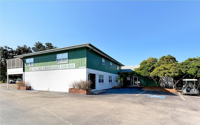 view of property exterior featuring a sunroom