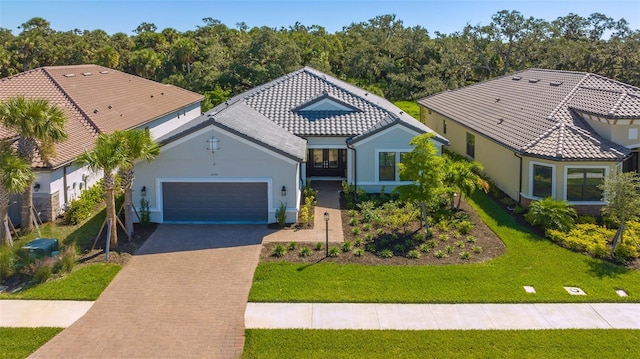 mediterranean / spanish house with a front lawn