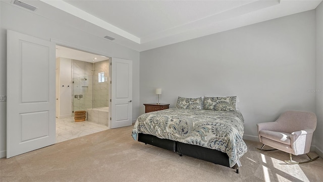 carpeted bedroom featuring ensuite bathroom