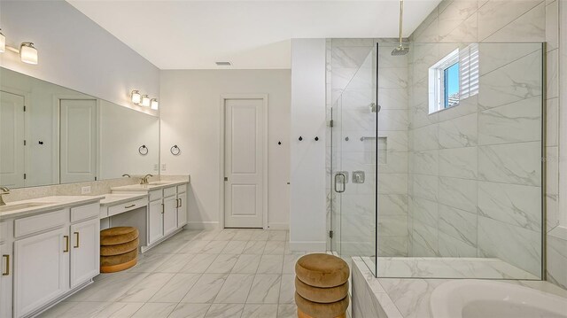 bathroom featuring vanity and separate shower and tub