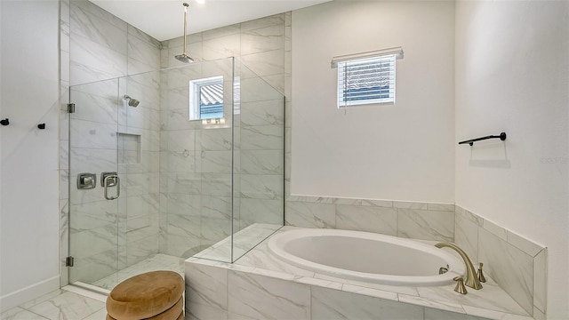 bathroom with plenty of natural light and independent shower and bath