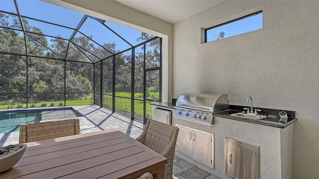 sunroom / solarium with a healthy amount of sunlight and sink