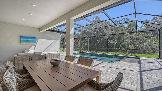 view of patio featuring glass enclosure