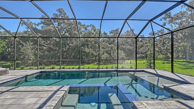 view of pool featuring glass enclosure and a patio