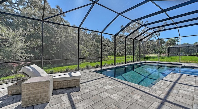 view of pool featuring a lanai, a yard, and a patio