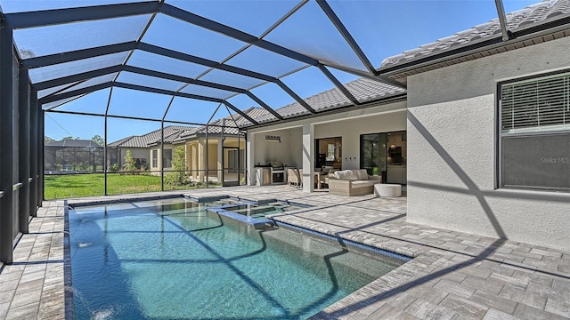 view of pool with a patio area, an in ground hot tub, and a lanai