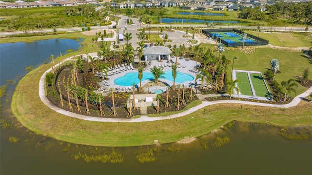 birds eye view of property with a water view