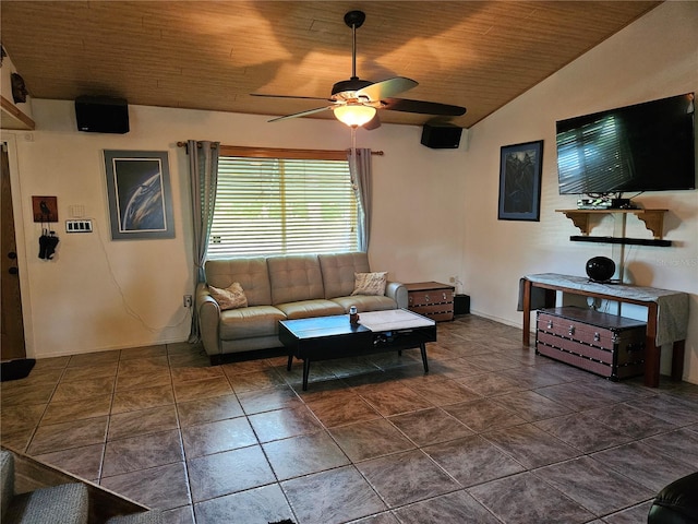 living room featuring dark tile patterned floors, lofted ceiling, ceiling fan, and wooden ceiling