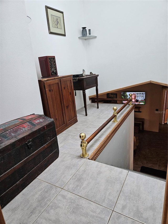 bedroom featuring light tile patterned flooring