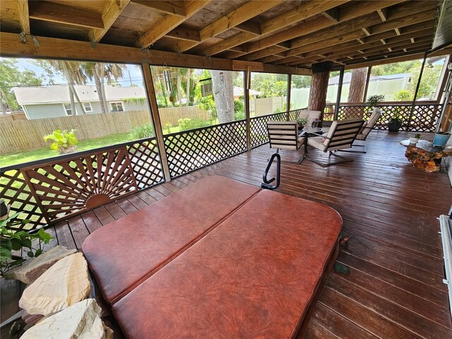 sunroom / solarium with beamed ceiling