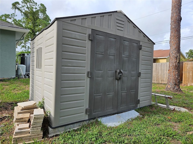 view of shed with fence